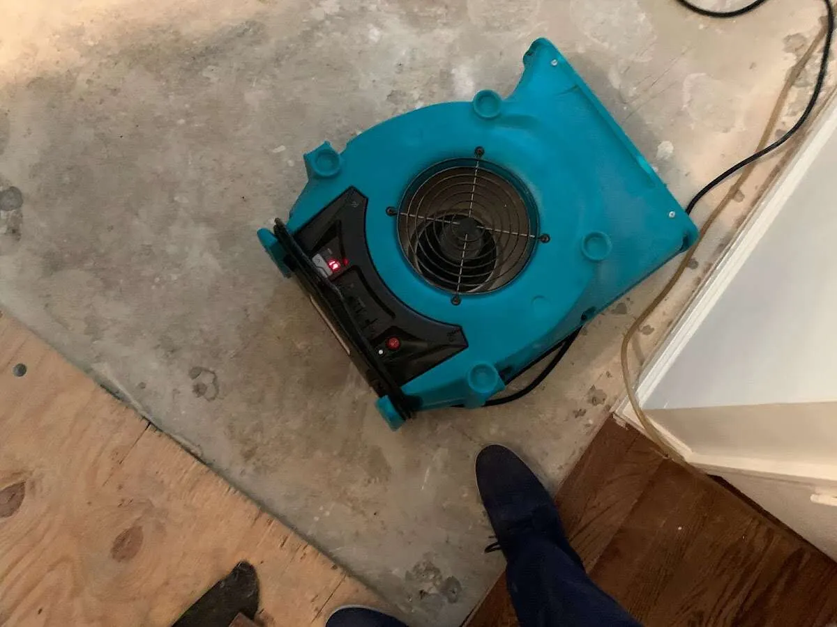 Air mover drying subfloor during Commercial Water Damage Restoration in Hamptonburgh